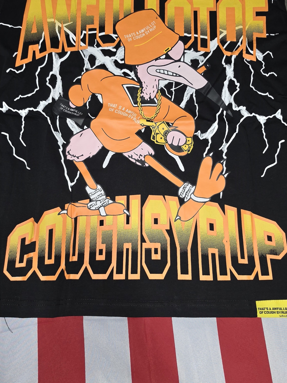 Graphic 'Cough Syrup' Cartoon Tee in Black & Orange